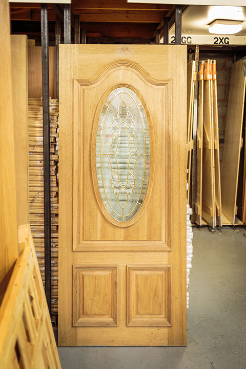 Panelled wooden door with glazing on display