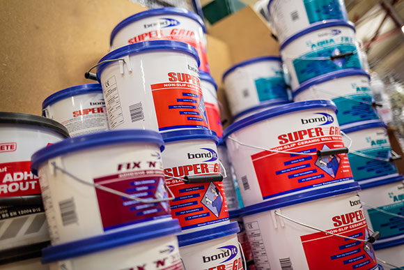 Tubs of adhesive and building products