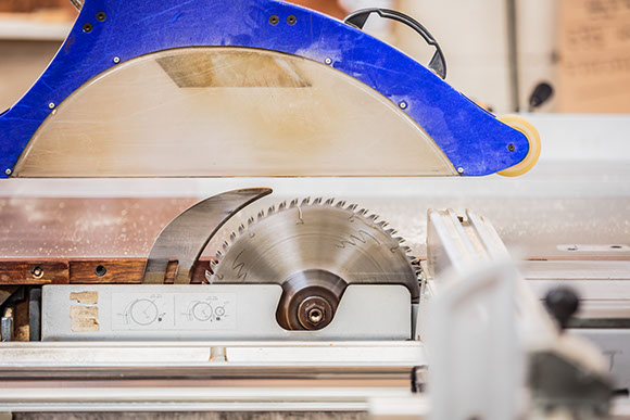Circular saw cutting timber to size in the yard